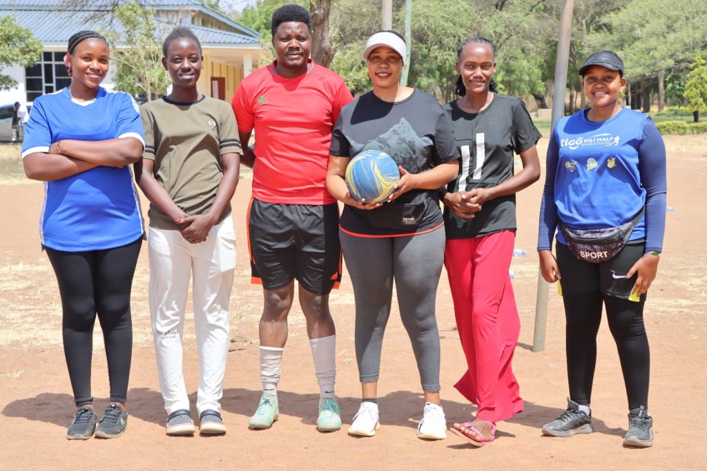 KICoB students taking part in a campus volleyball match.